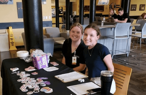 Students Morgan Park (L) and Izzy Scchaar at their Voter Engagement table in the Alumni Student Center